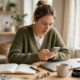 Social Media Content Ideas for Small Business: A Simple Plan That Keeps You Posting 45 A small business owner creating social media content ideas for small business on a phone.