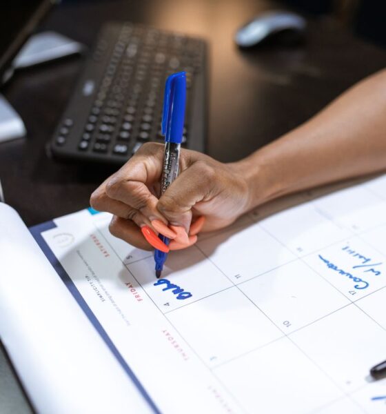 Small business owner creating a small business content marketing plan at a desk